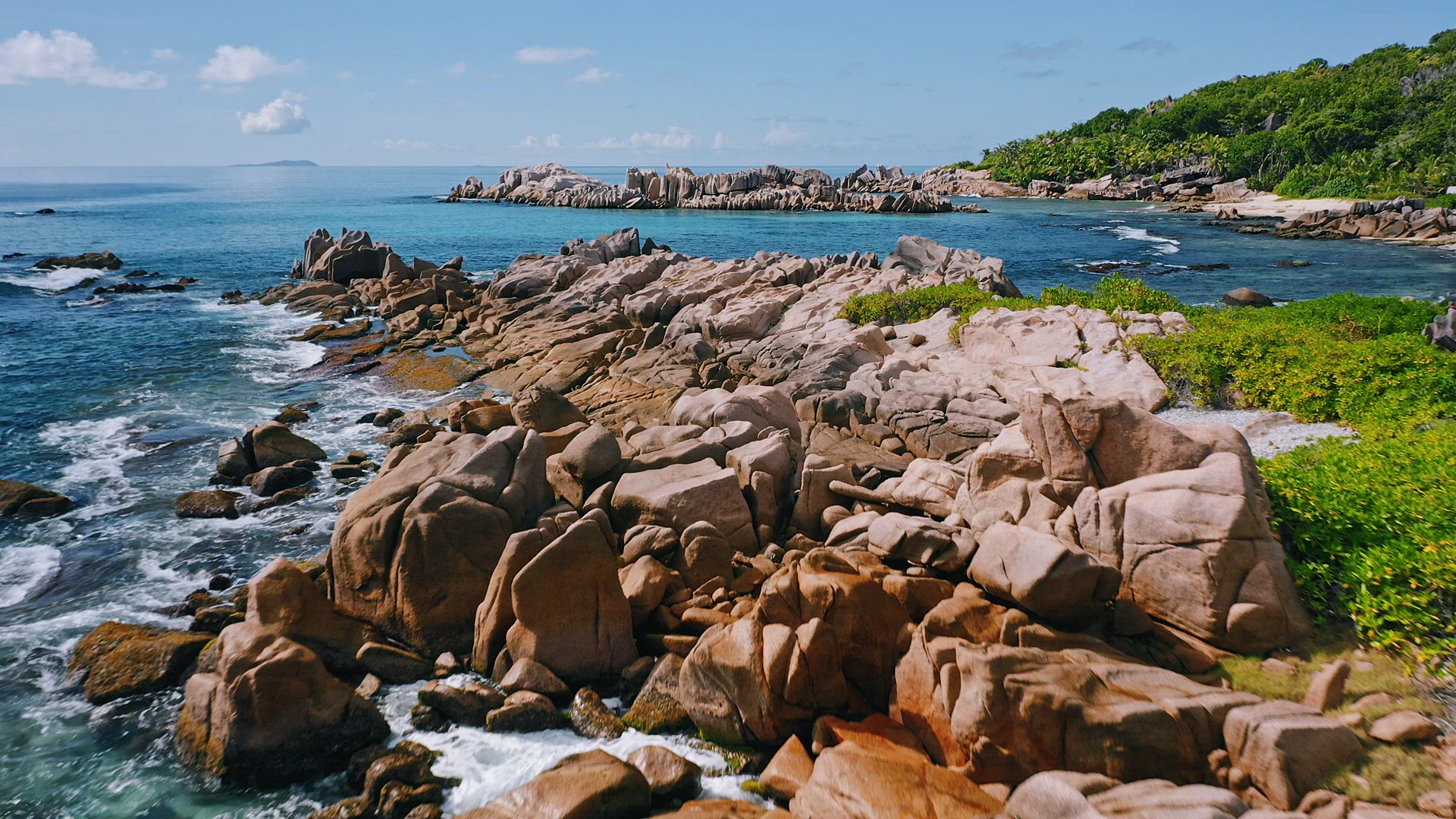 Aerial view of unique coastline with nature granite boulders on remote paradise like beach hidden in
