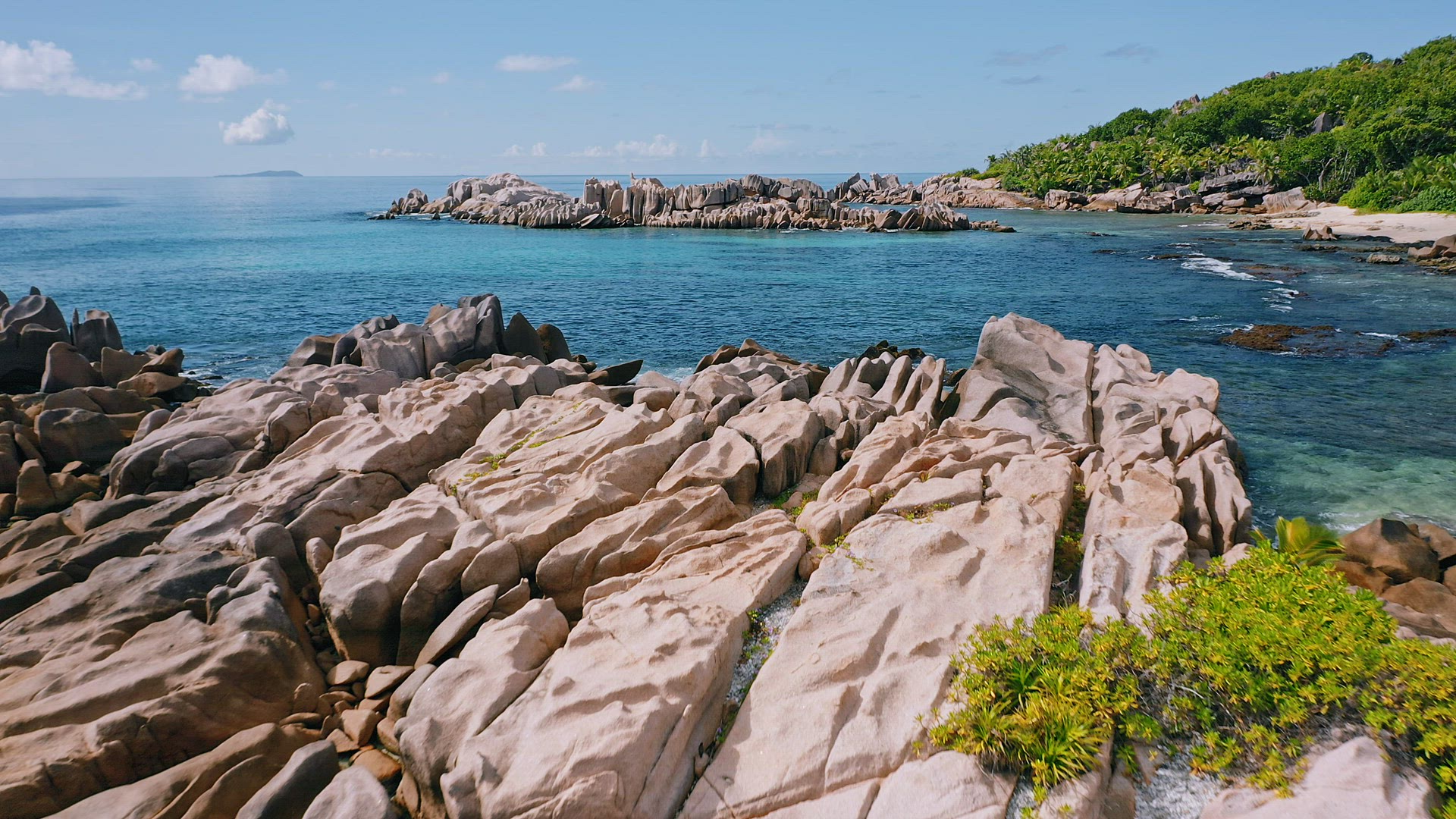 Aerial view of unique seychelles coastline with nature granite boulders on remote paradise like beac