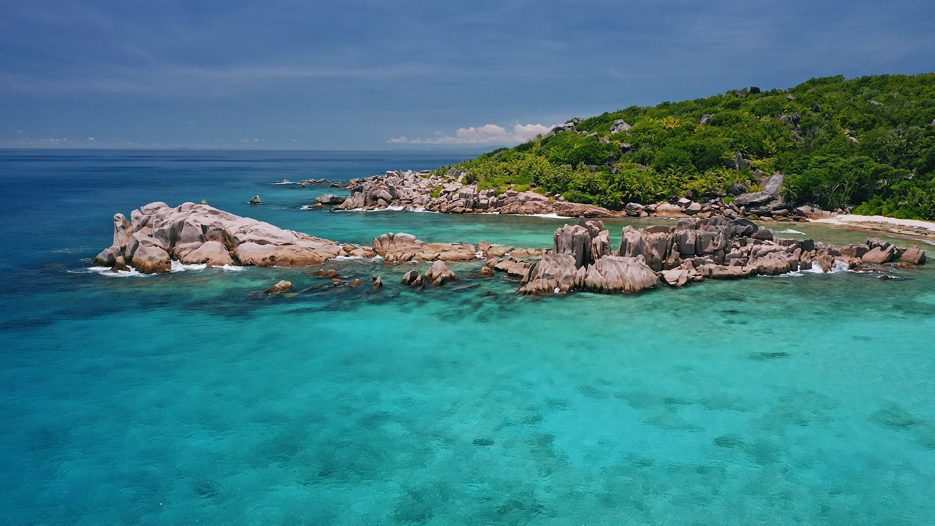 Aerial view of unique coastline with nature granite boulders on remote paradise like beach hidden in