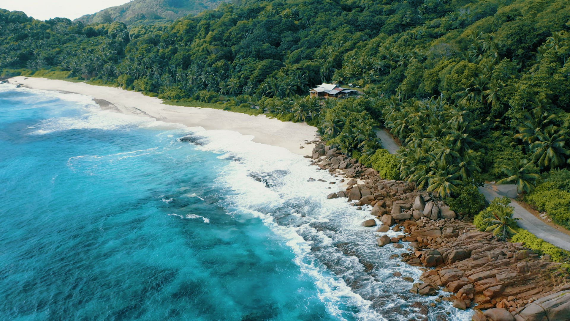 Epic aerial drone 4k flight towards tropical paradise Anse Bazarca beach on Mahe island. White sand,