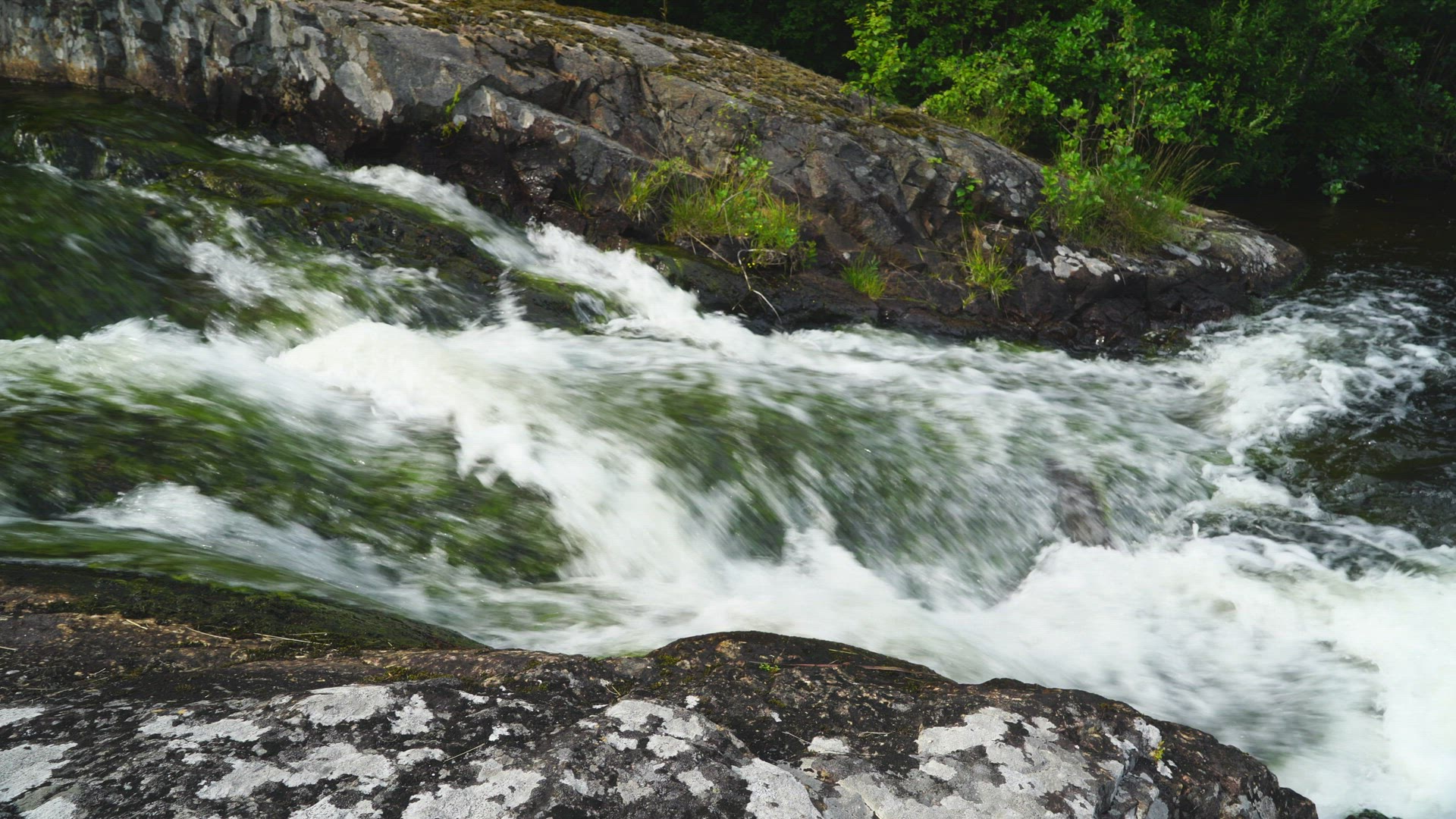 small waterfall in river - pan