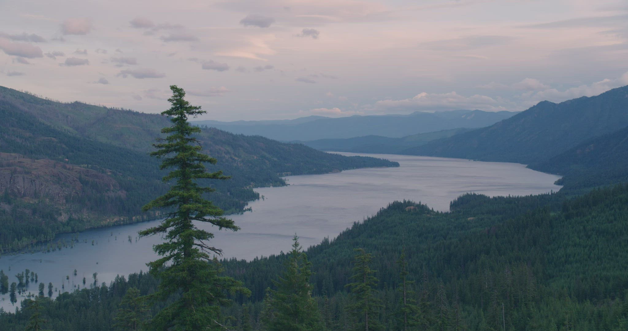 Wide static shot of lake at twilight