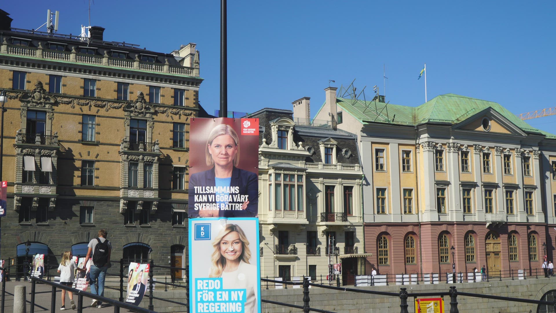 political campaign posters in street in Stockholm - prime ministers residence in background