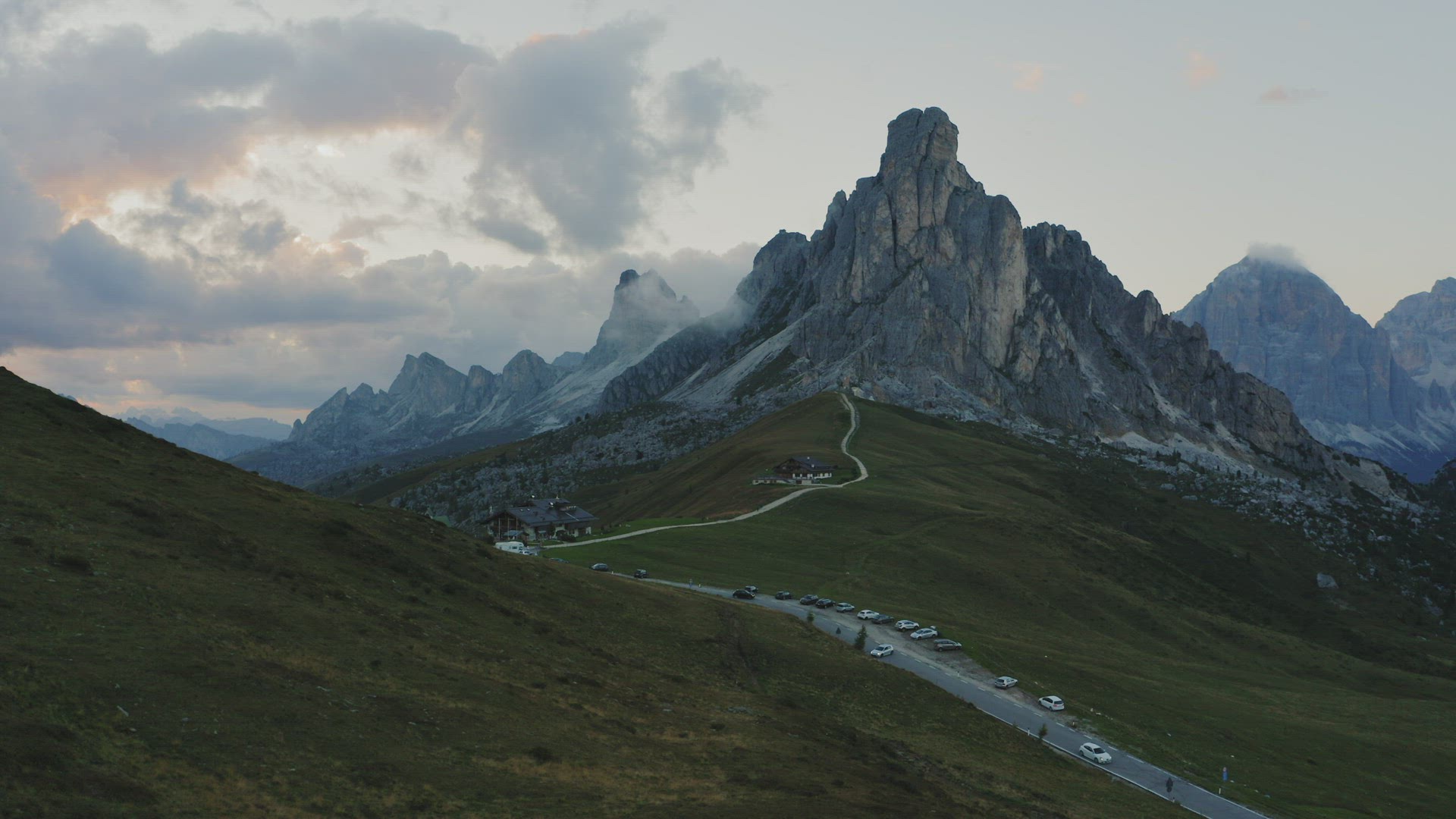 Dolomites mountains the Passo di Giau, Monte Gusela at behind Nuvolau gruppe at sunset light. Aerial