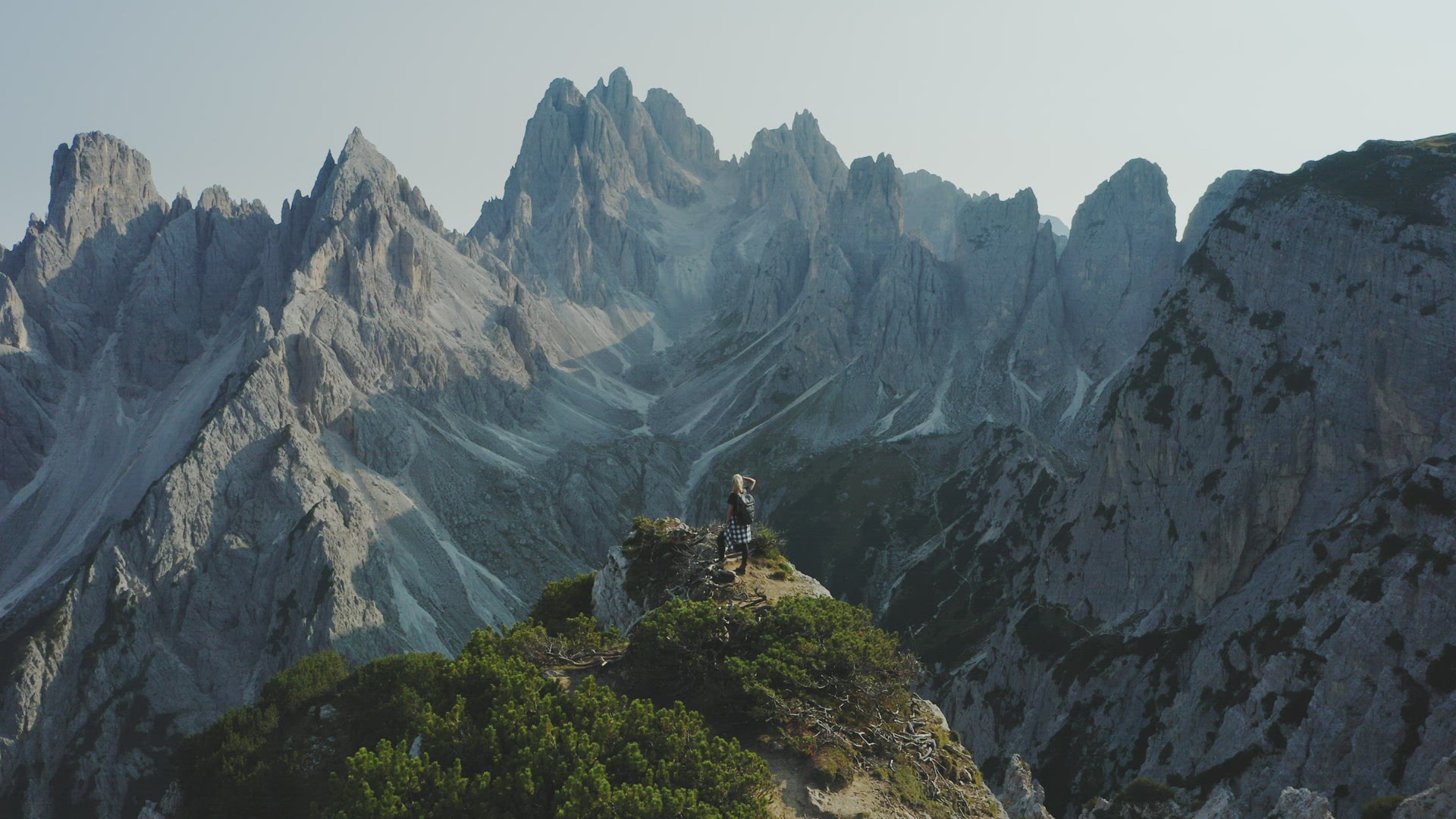 Dolomites, Italy. Women hiker admire beautiful Auronzo di Cadore peaks of Cadini di Misurina mountai