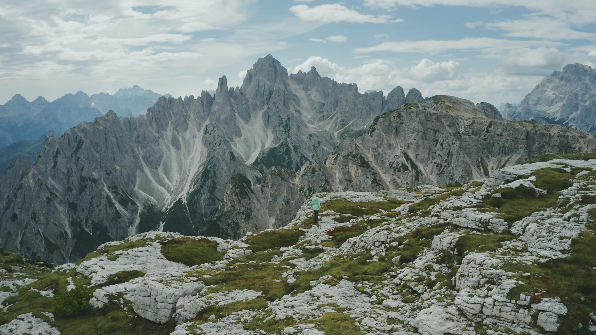 Aerial view of women hiking close to Auronzo di Cadore of Cadini di Misurina mountains group in Dolo