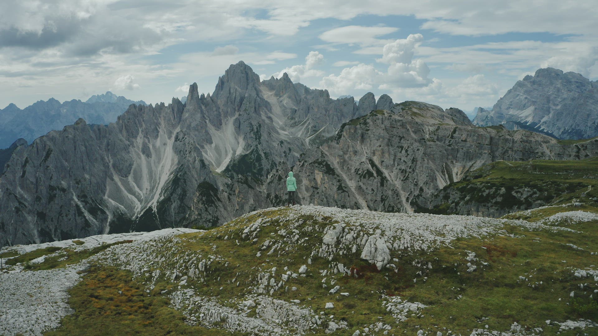 Aerial view of women hiking close to Auronzo di Cadore of Cadini di Misurina mountains group in Dolo