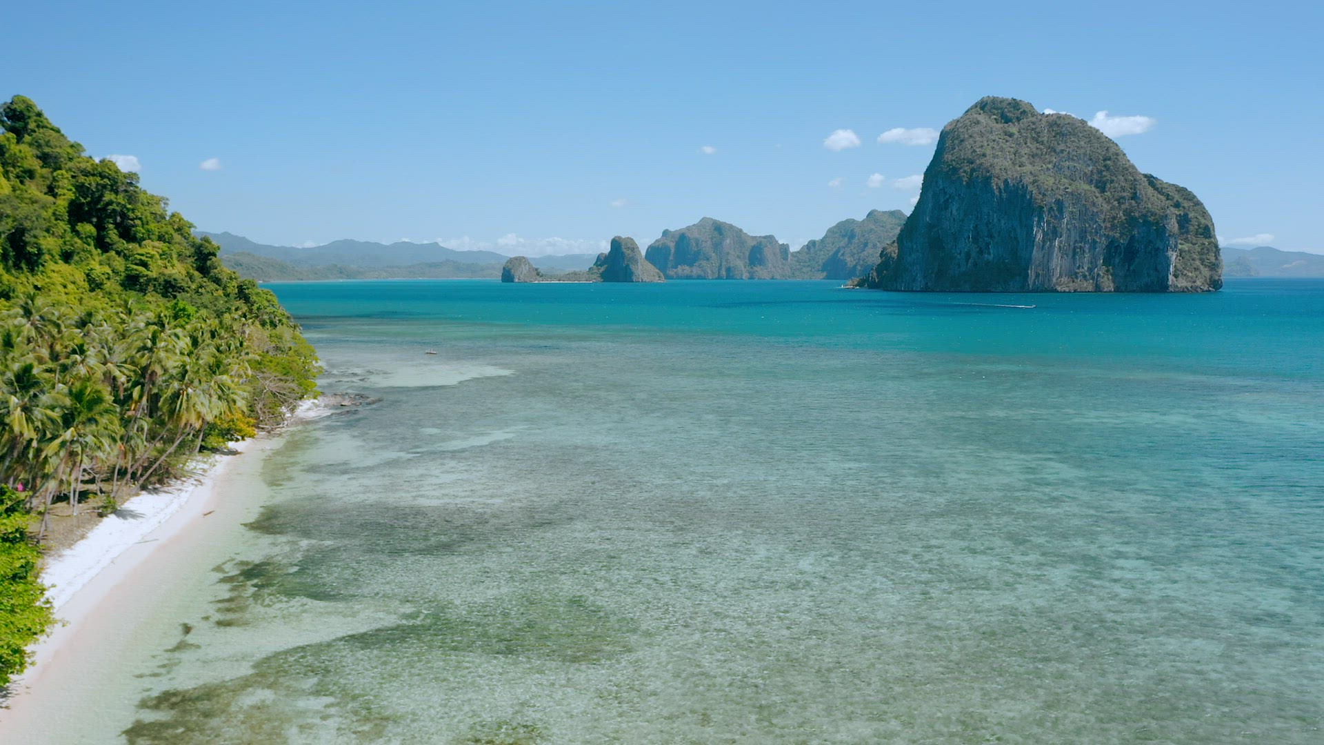 Aerial drone coastline view from Las Cabanas beach to Pinagbuyutan island direction. El Nido, Palawa