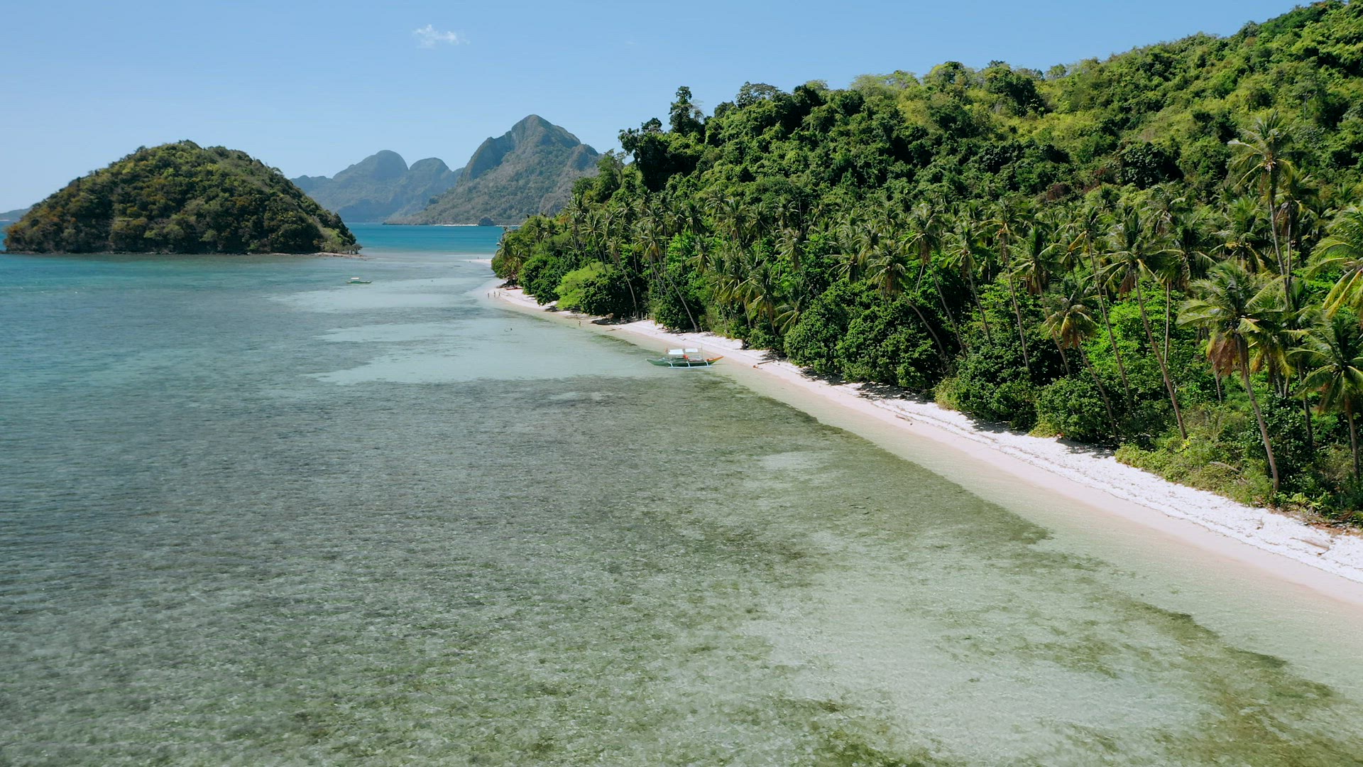 4k Aerial drone flying above shallow clear water circle the paradise tropical beach with coconut pal
