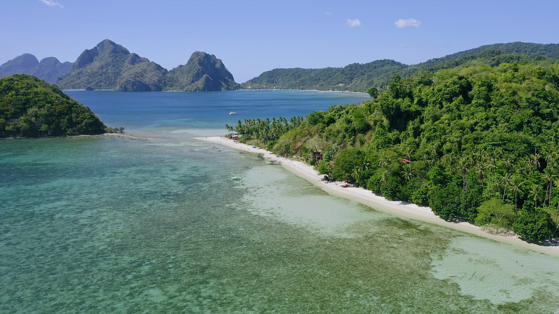 4k Aerial drone fly above las cabanas sandy beach with palm trees. El Nido in background. Palawan, P