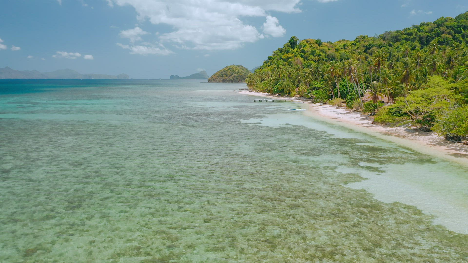 4k Aerial drone flying over shallow clear water near to paradise tropical beach. Exploring El Nido, 