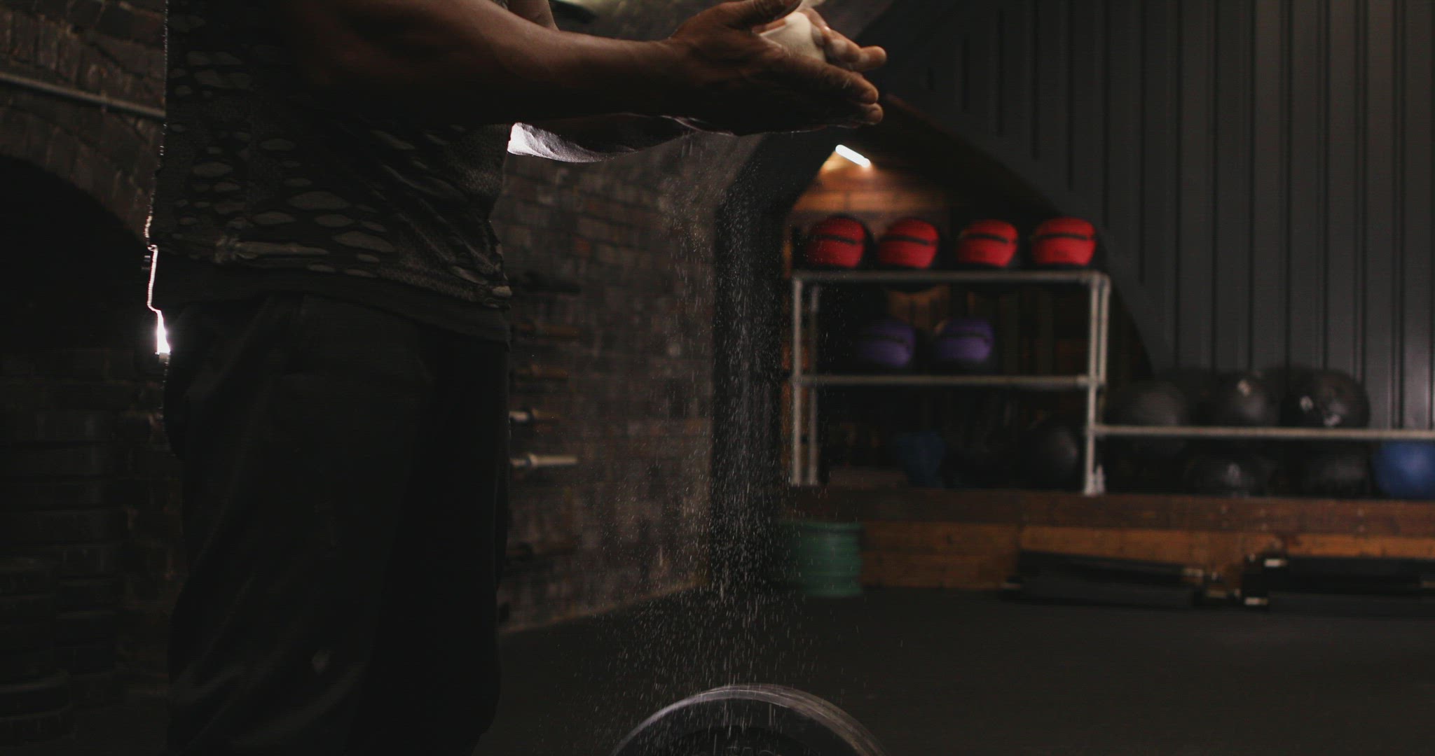 Man using chalk at gym