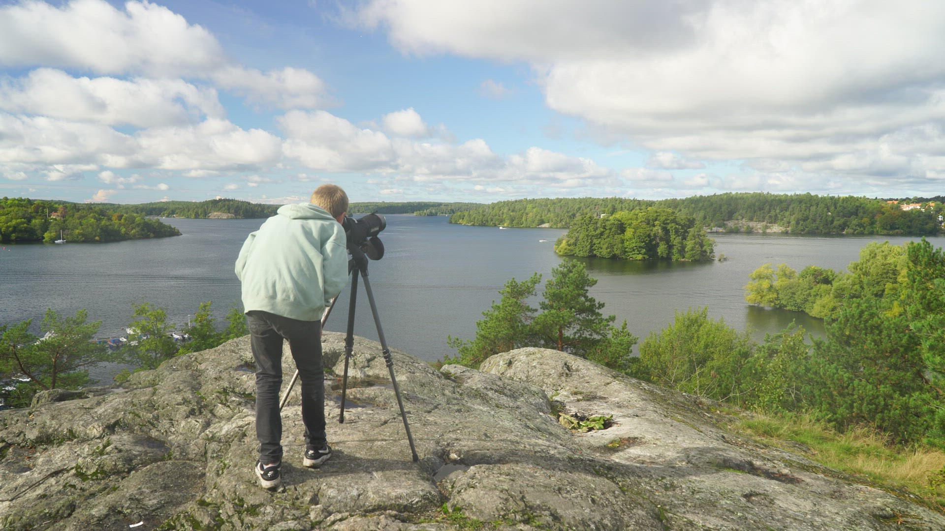 boy with monocular - watching birds