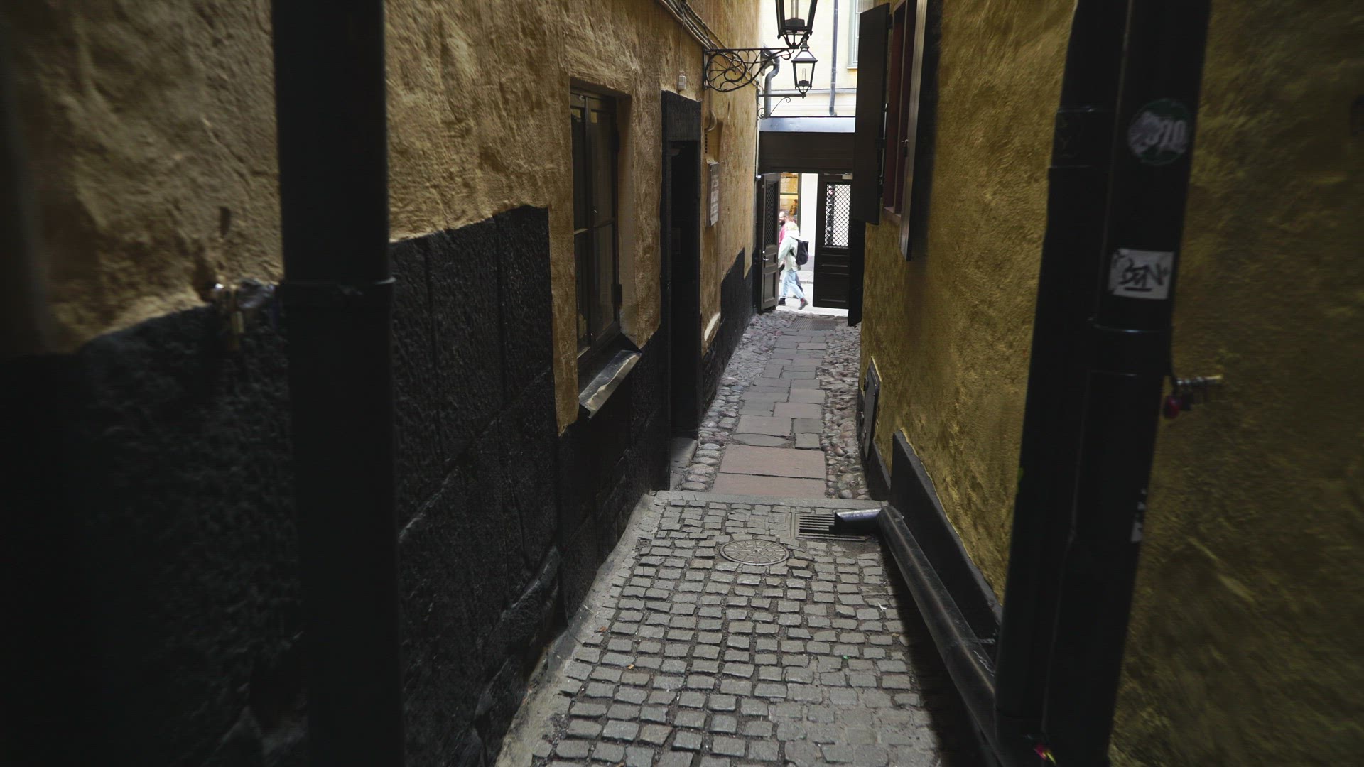 pov walking down stairs on steep narrow street in old town in Stockholm