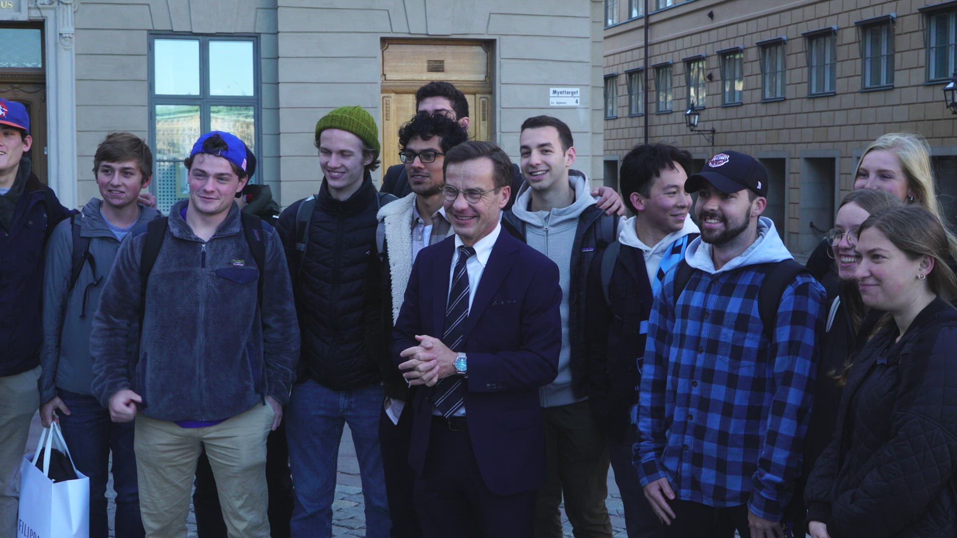 Sweden Prime Minister Ulf Kristersson outside party headquarter  - with american students