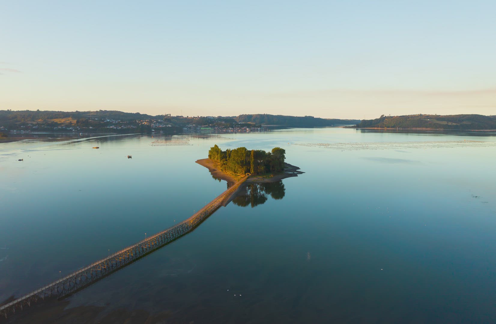 Aucar island in Chile, showing the golden sky at sunset.