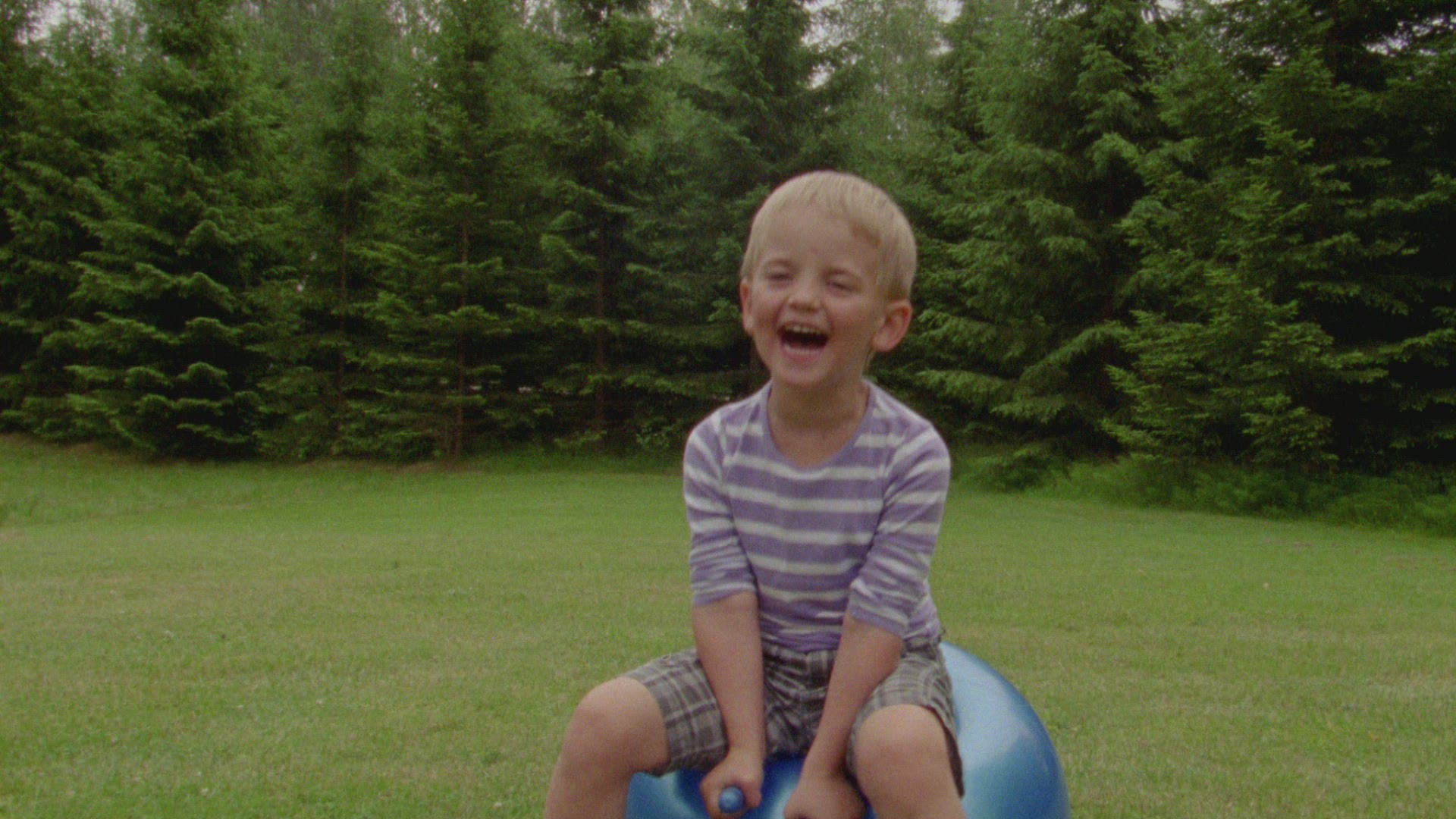 boy playing with bouncing ball - bounces and falls off
