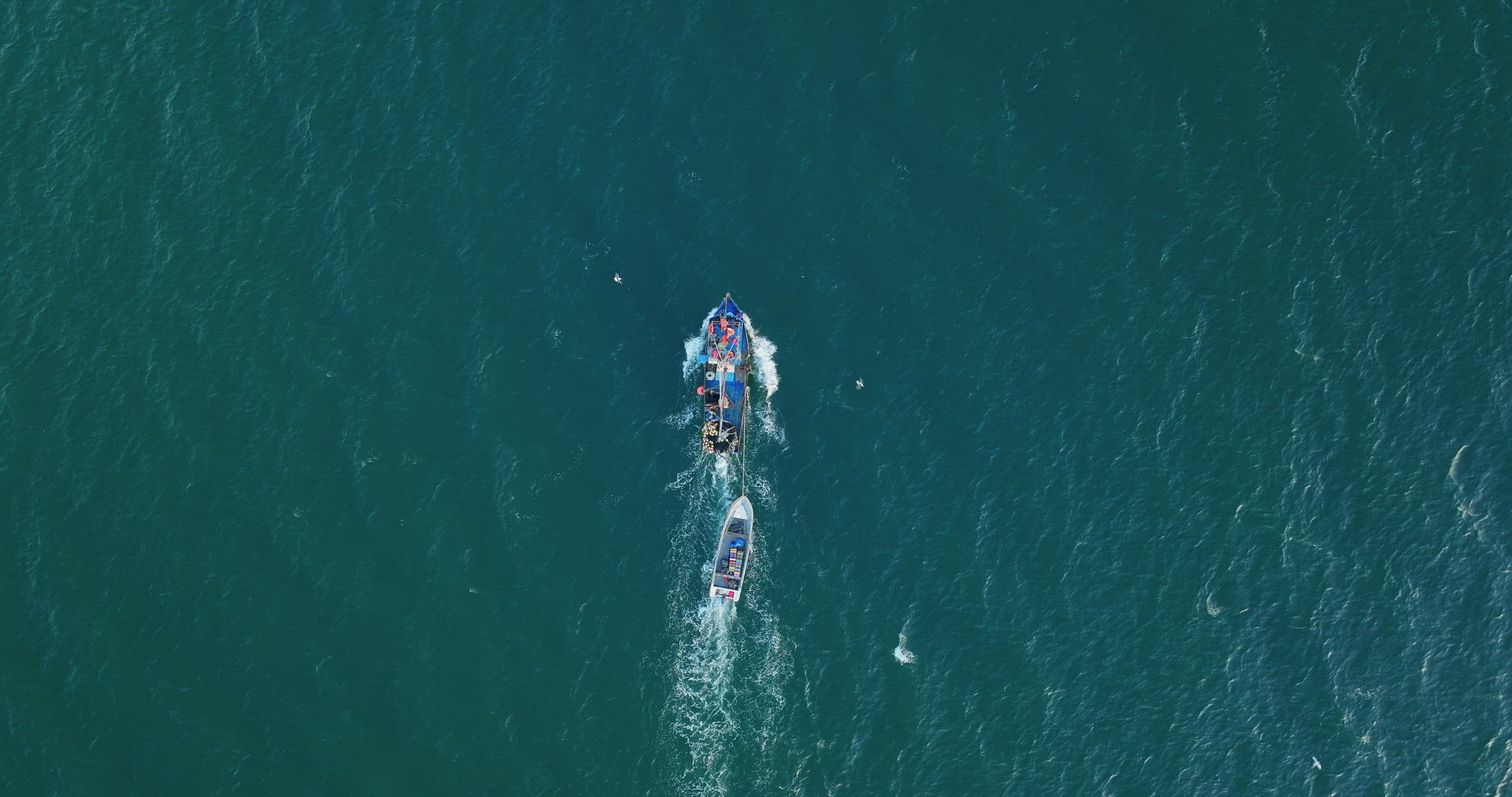 Aerial Birds Eye View Of Motorised Fishing Boat Sailing