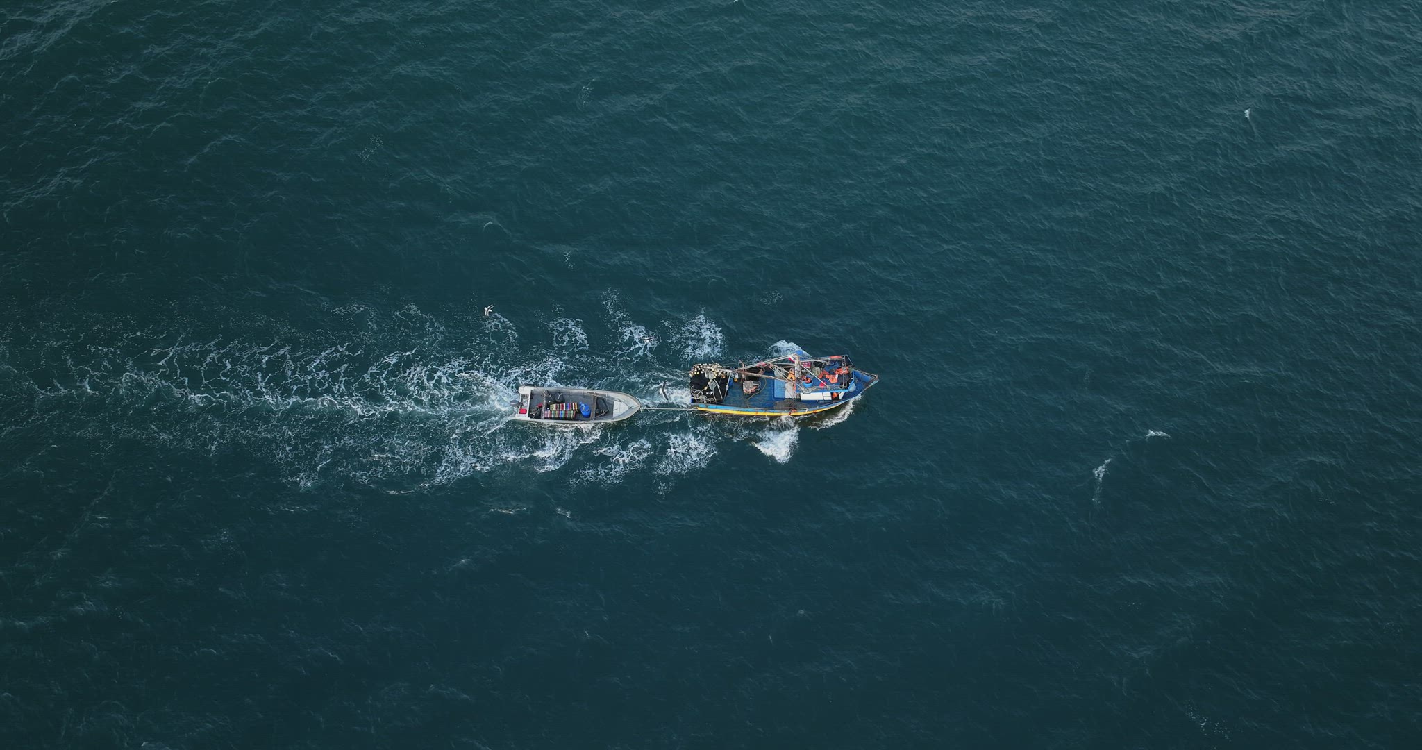 Aerial Birds Eye View Of Motorised Fishing Boat Sailing