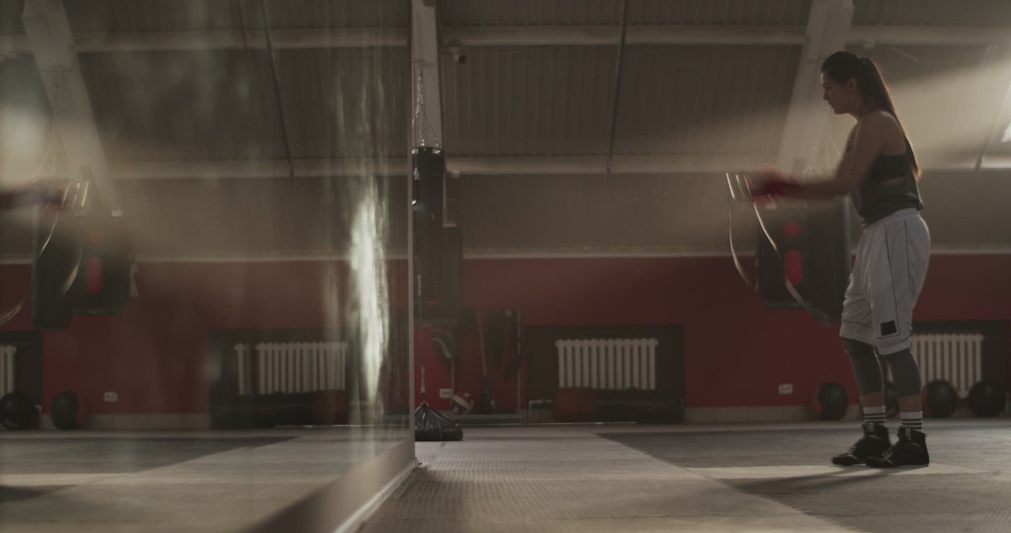 Sportswoman exercising with jumping rope