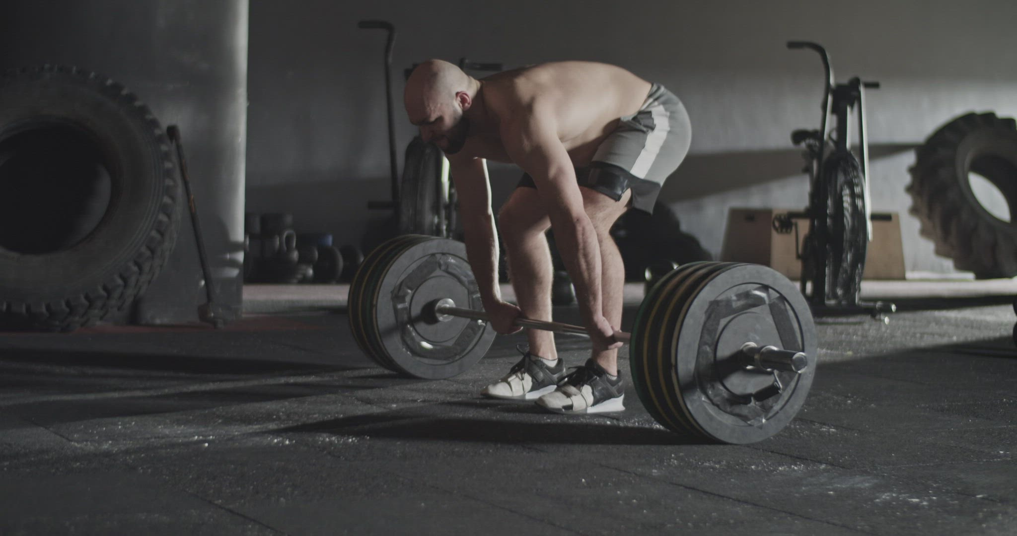 Sportswoman doing unsuccessful attempt during deadlift exercise