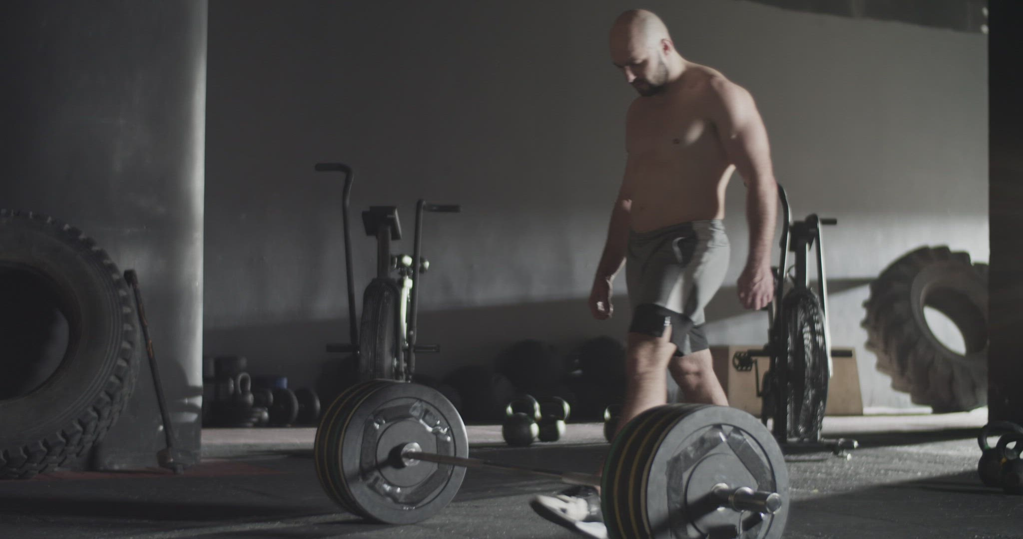Sportswoman doing unsuccessful attempt during deadlift exercise