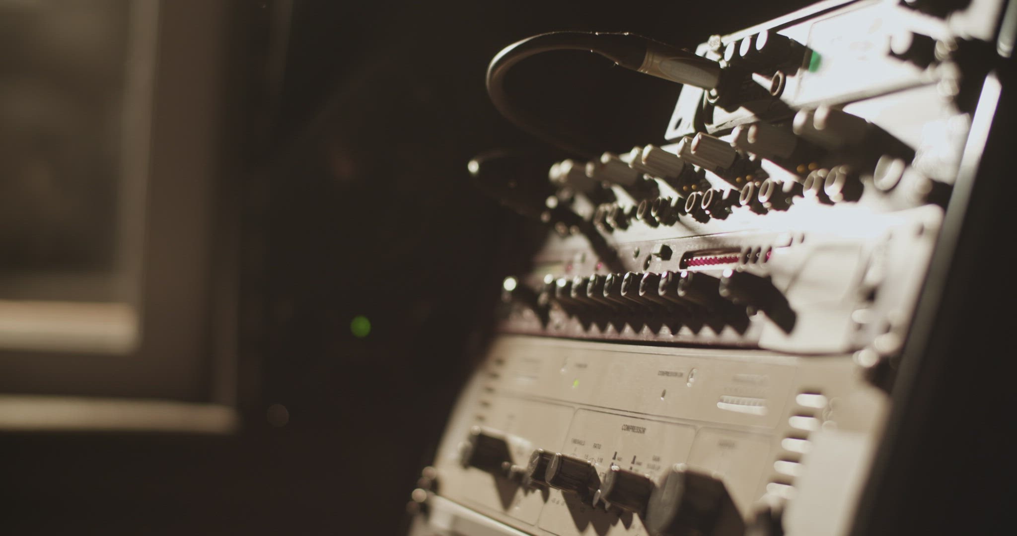 Musician tuning amplifier in studio