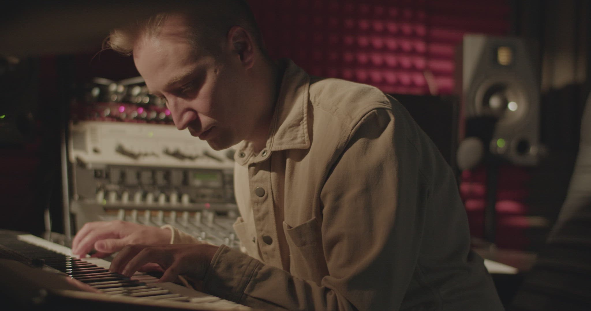 Pianist playing digital keyboard in studio