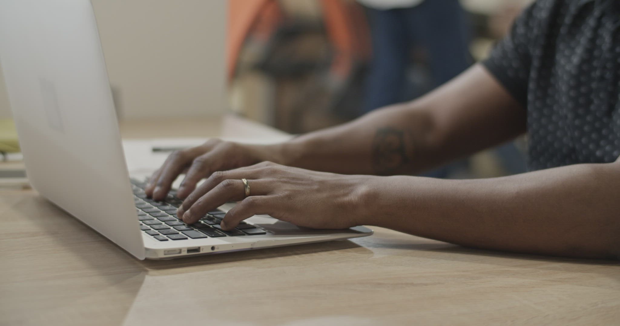 Black man using laptop in office