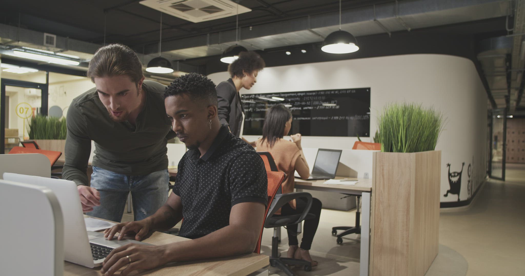 Diverse colleagues collaborating in office