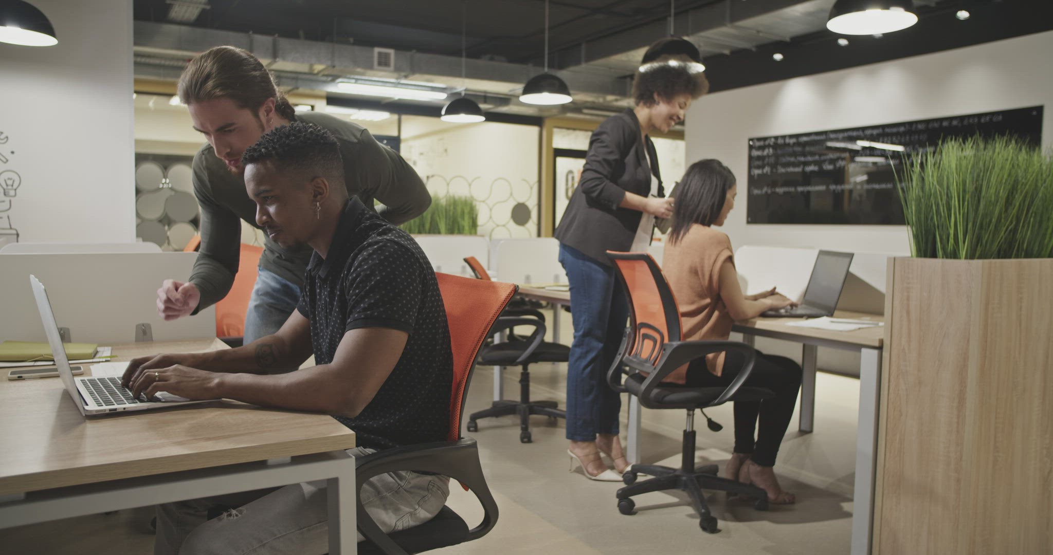 Diverse colleagues collaborating in office