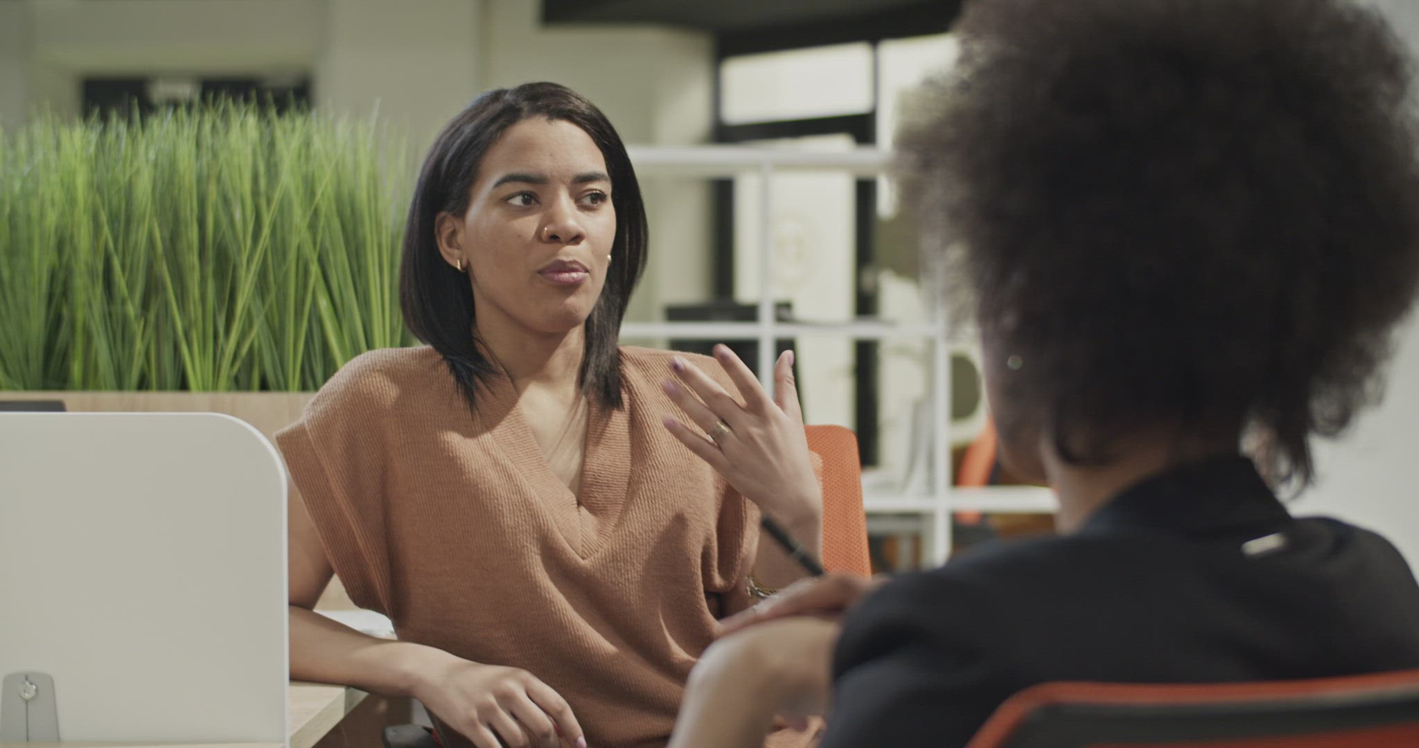 Woman speaking with employer during job interview