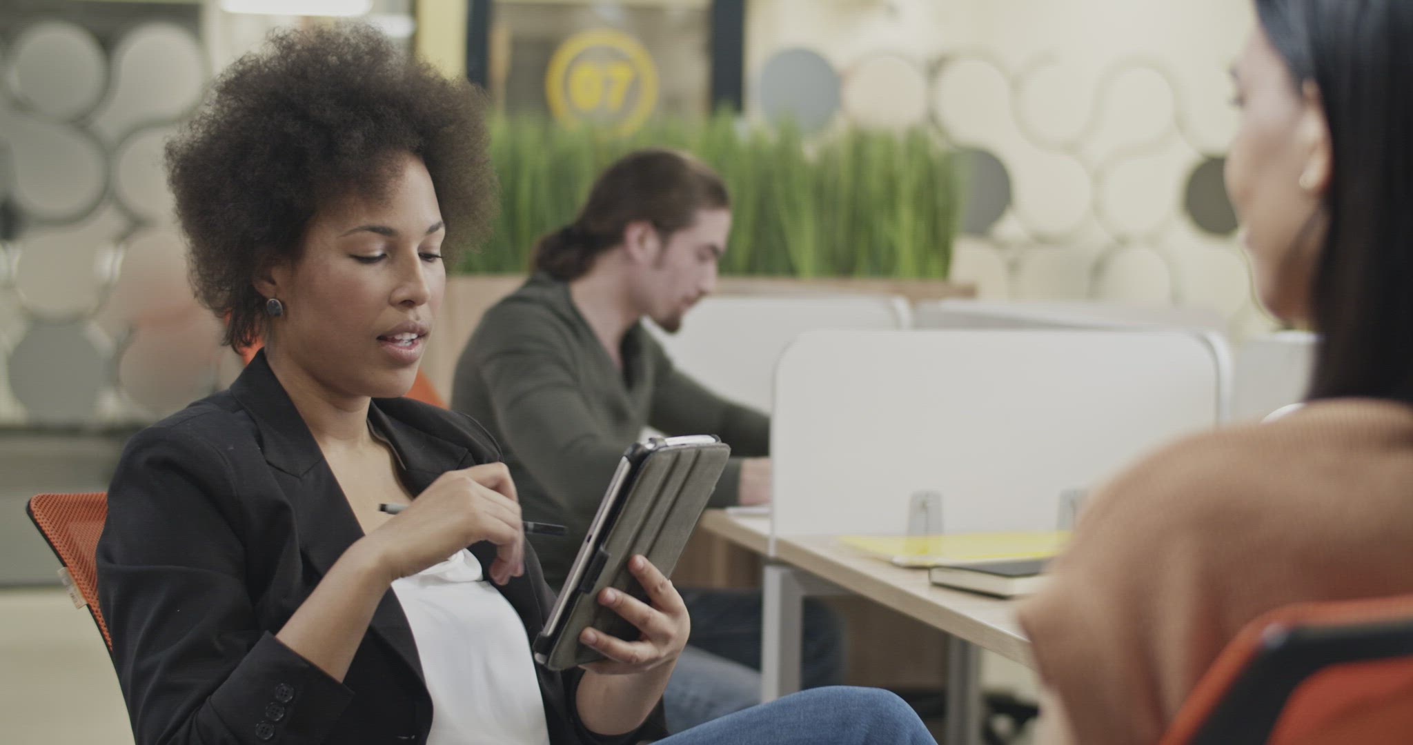 Black HR manager speaking with employee