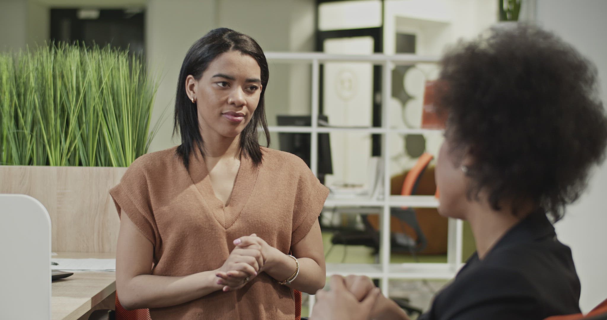 Woman speaking with employer during job interview