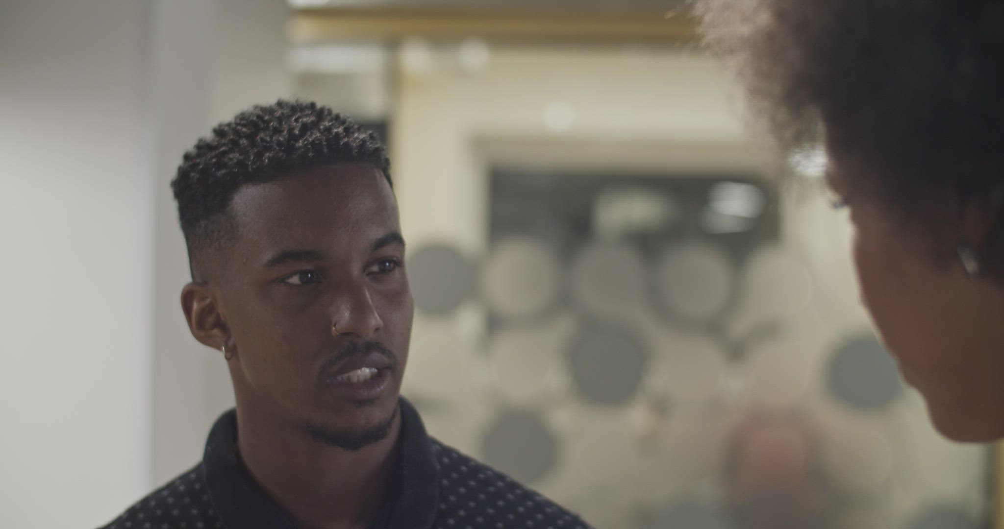 Black man speaking with colleague
