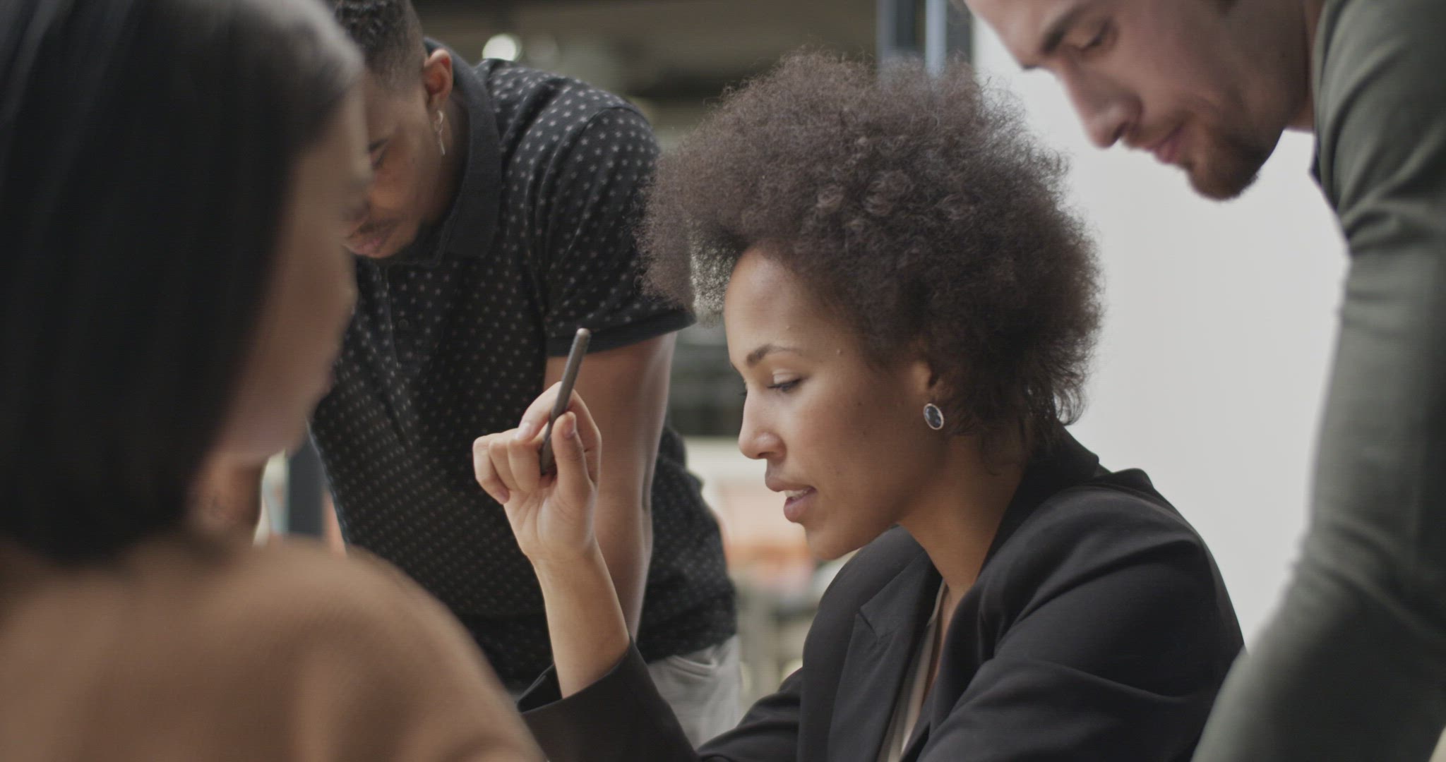 Diverse colleagues brainstorming in office