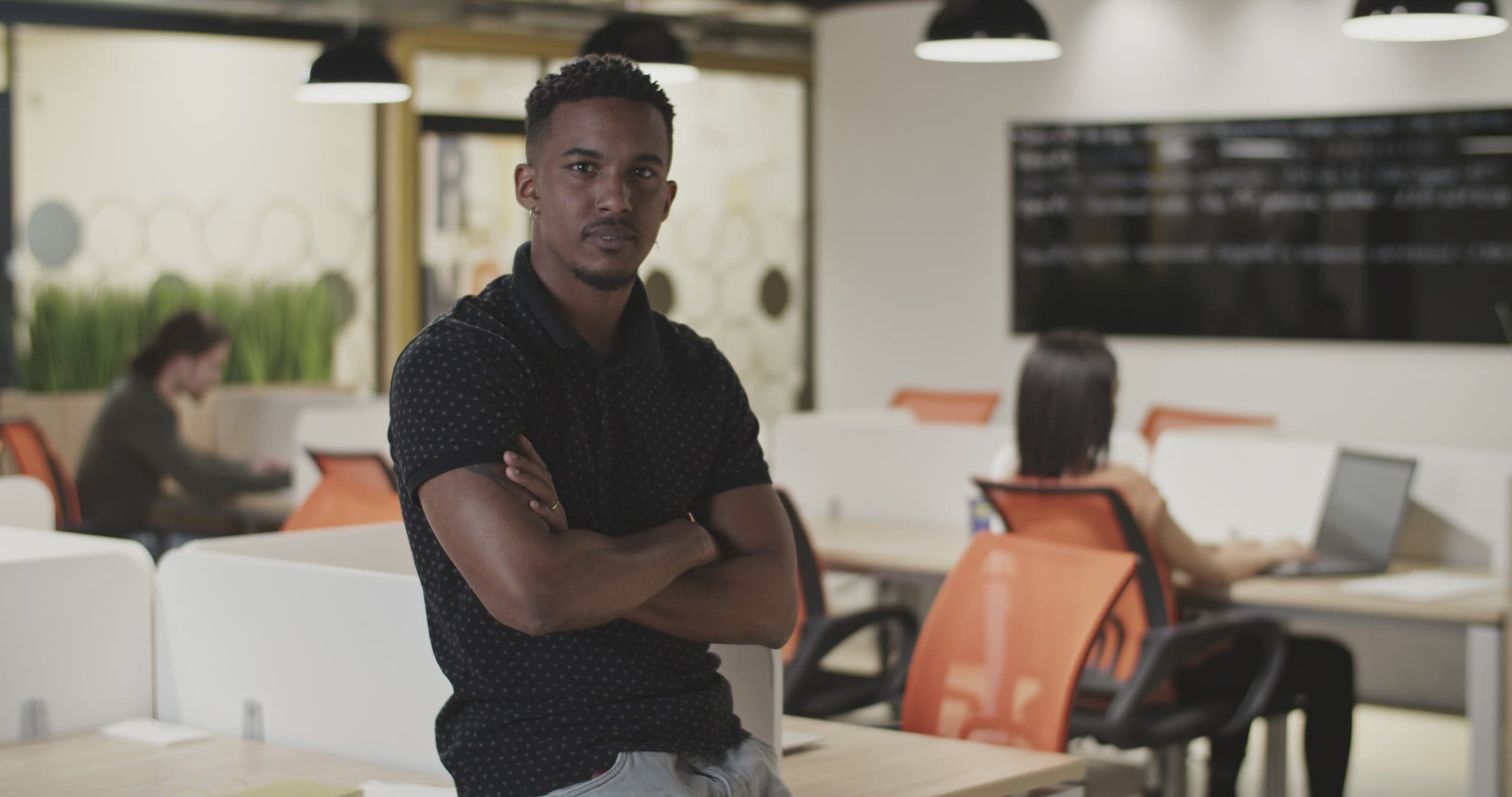 Friendly black manager in workspace