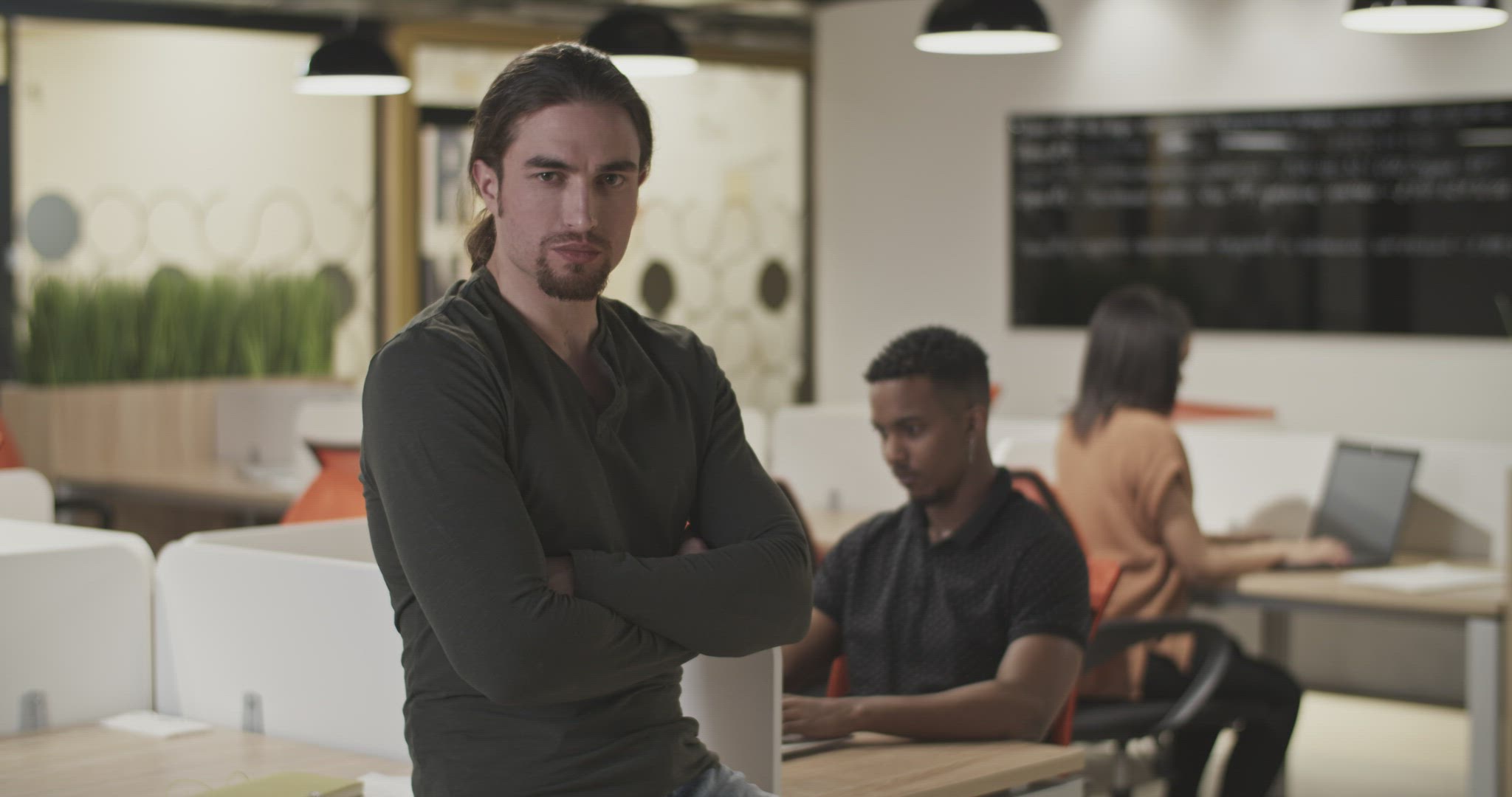 Confident employee in coworking space