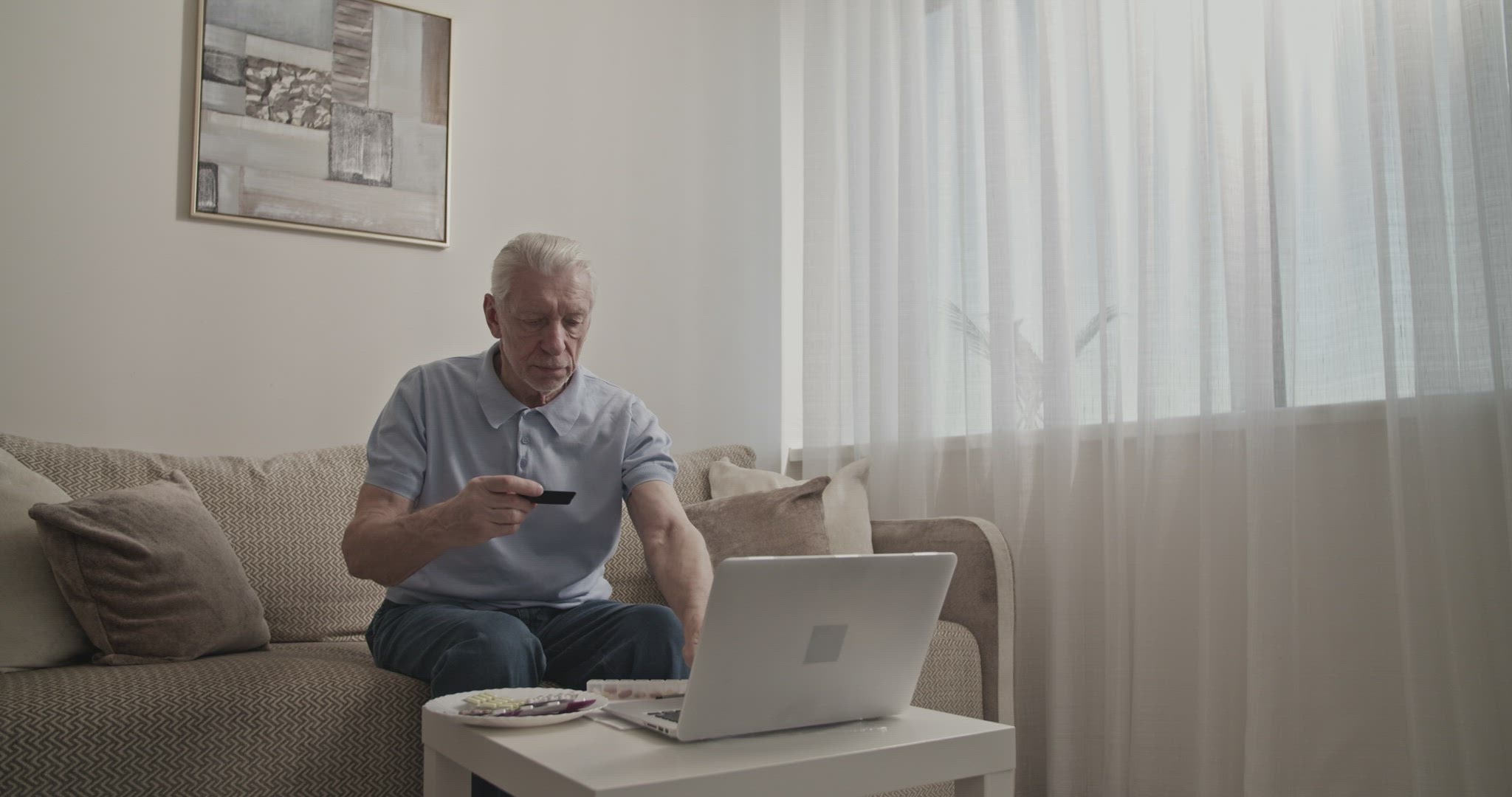 Senior man making online purchases