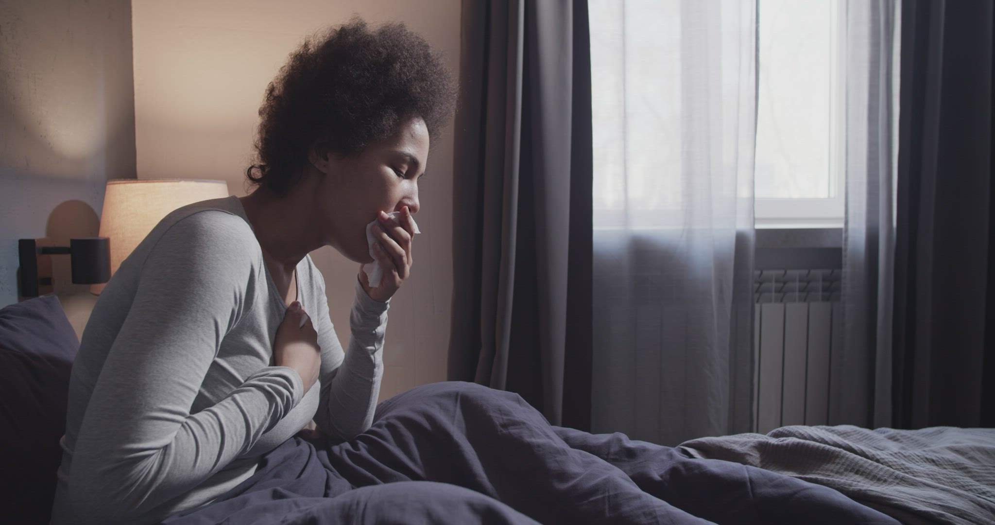 Black female coughing in morning
