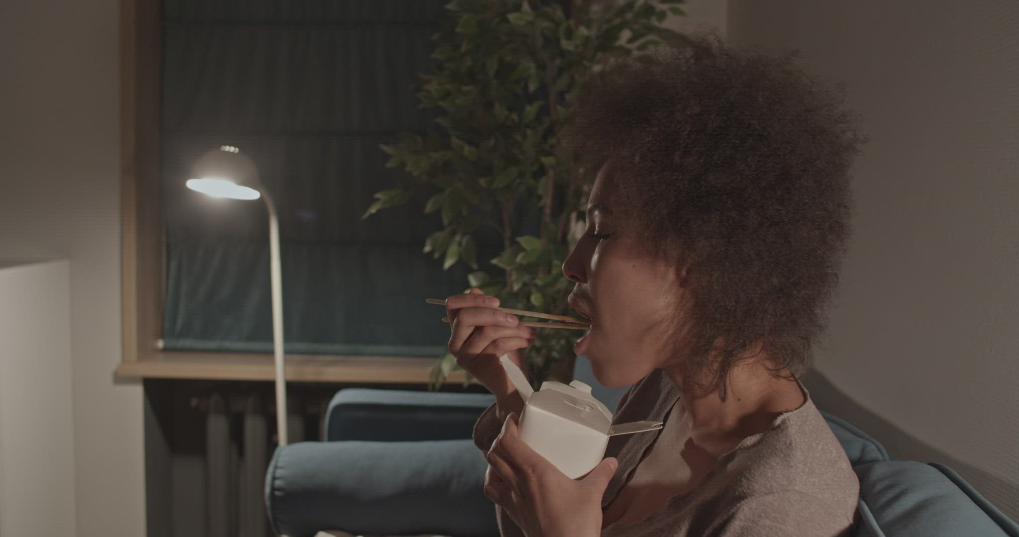Black female eating delivery food