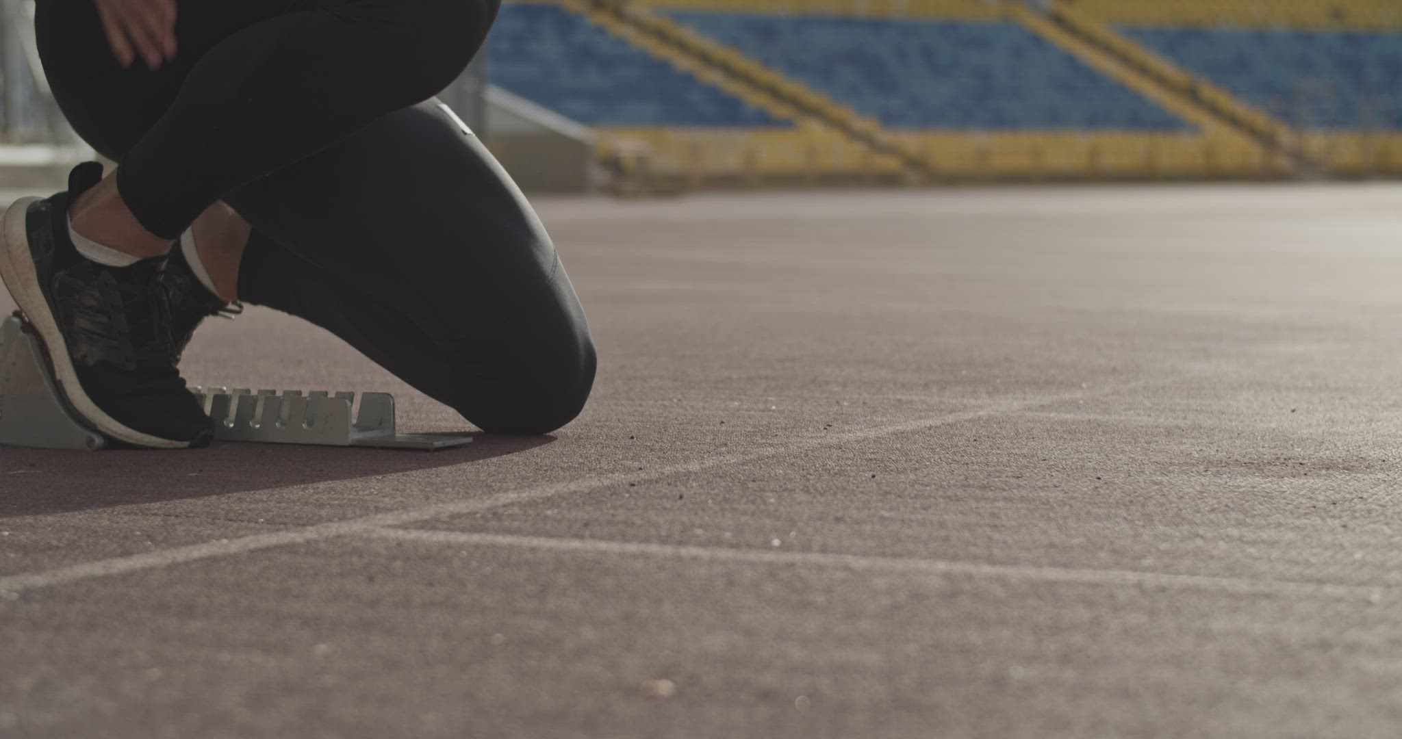 Cropped runner preparing for race