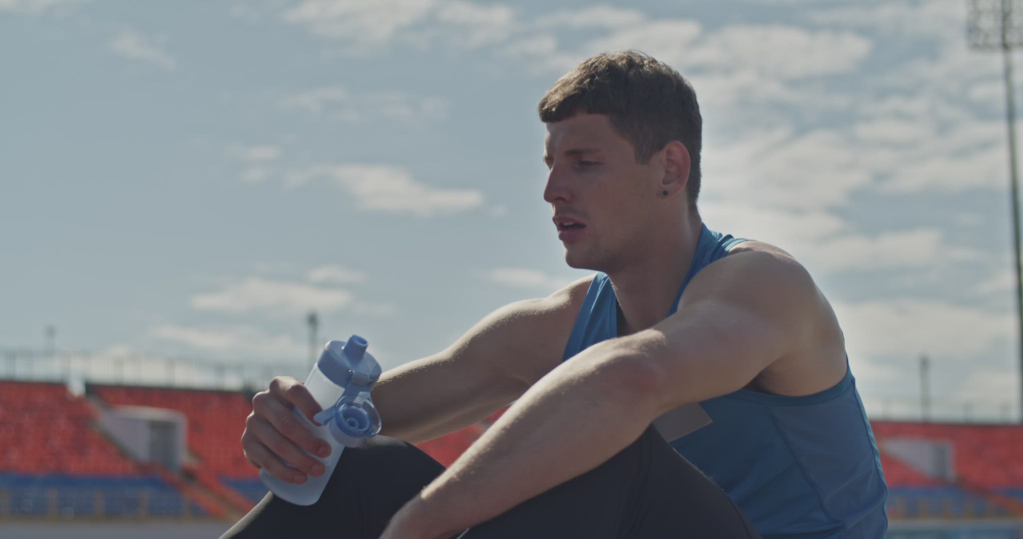 Runner drinking water during break