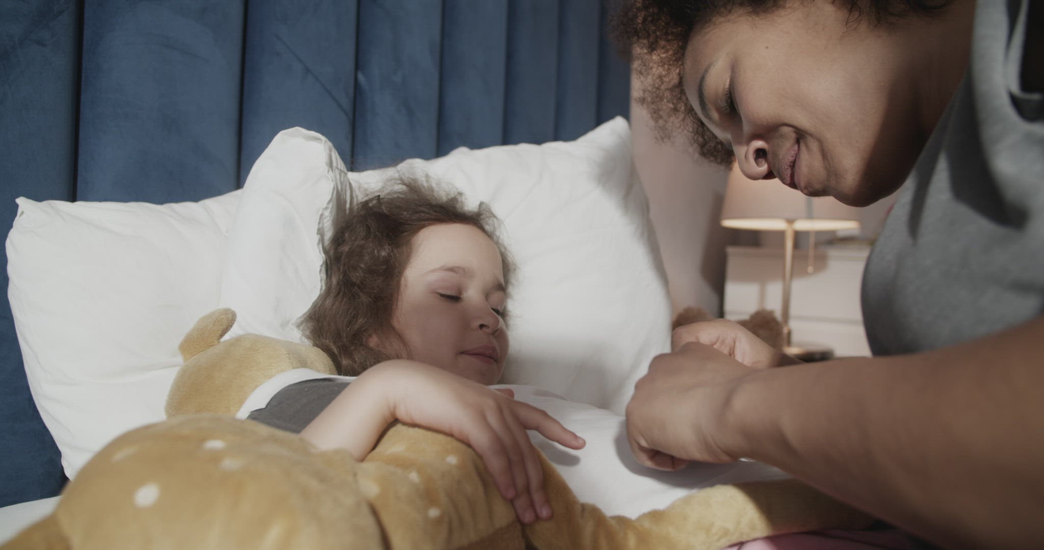 Mother and daughter measuring temperature and speaking