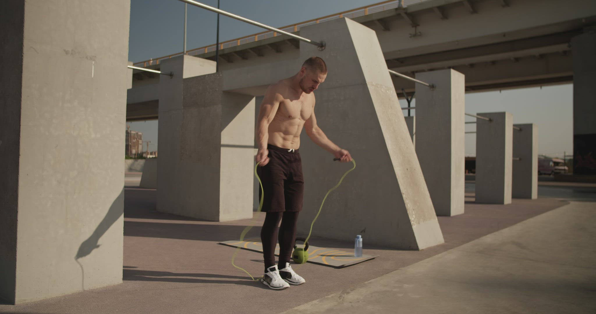Sportsman exercising with jumping rope