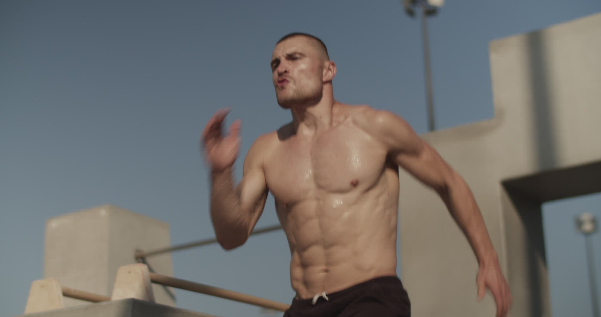 Sweaty sportsman running on spot