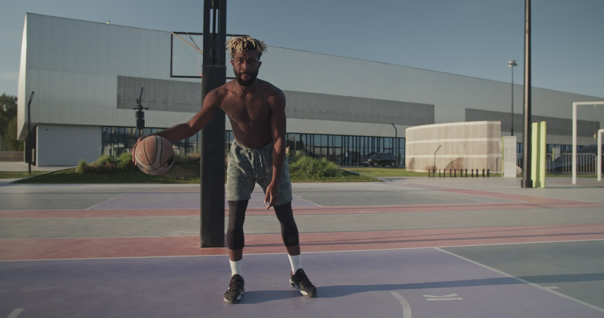 African American athlete doing freestyle basketball tricks