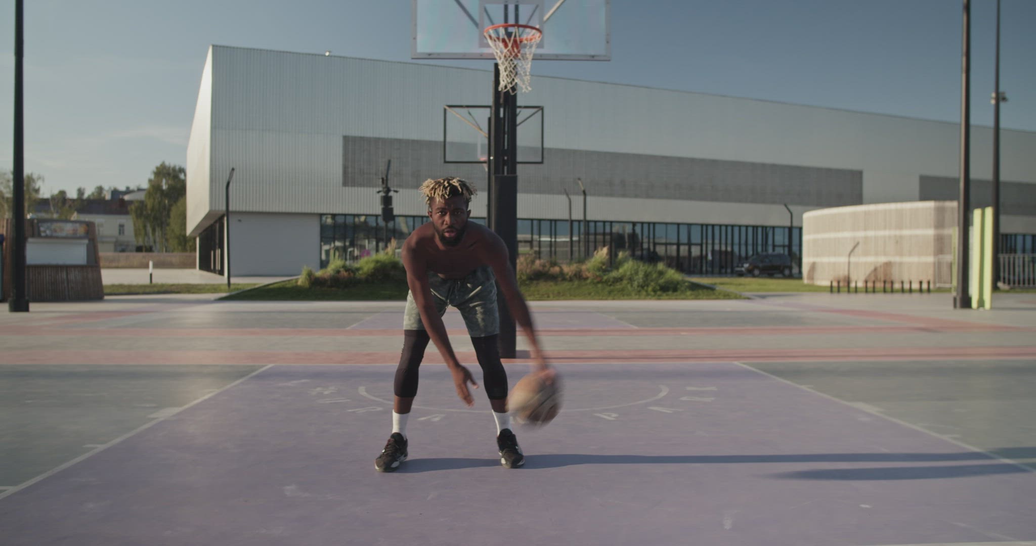African American athlete doing freestyle basketball tricks