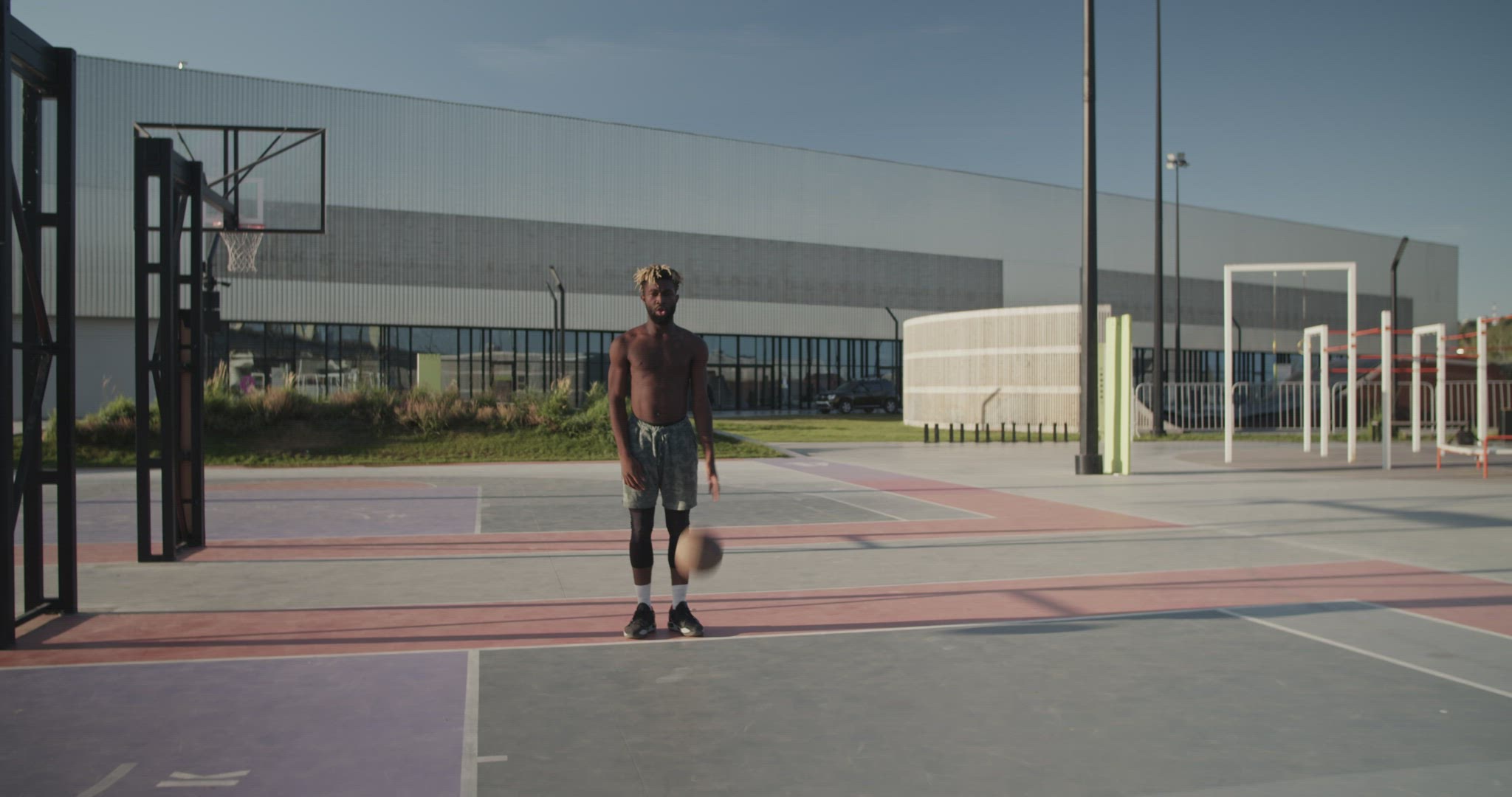 African American basketball player running towards camera