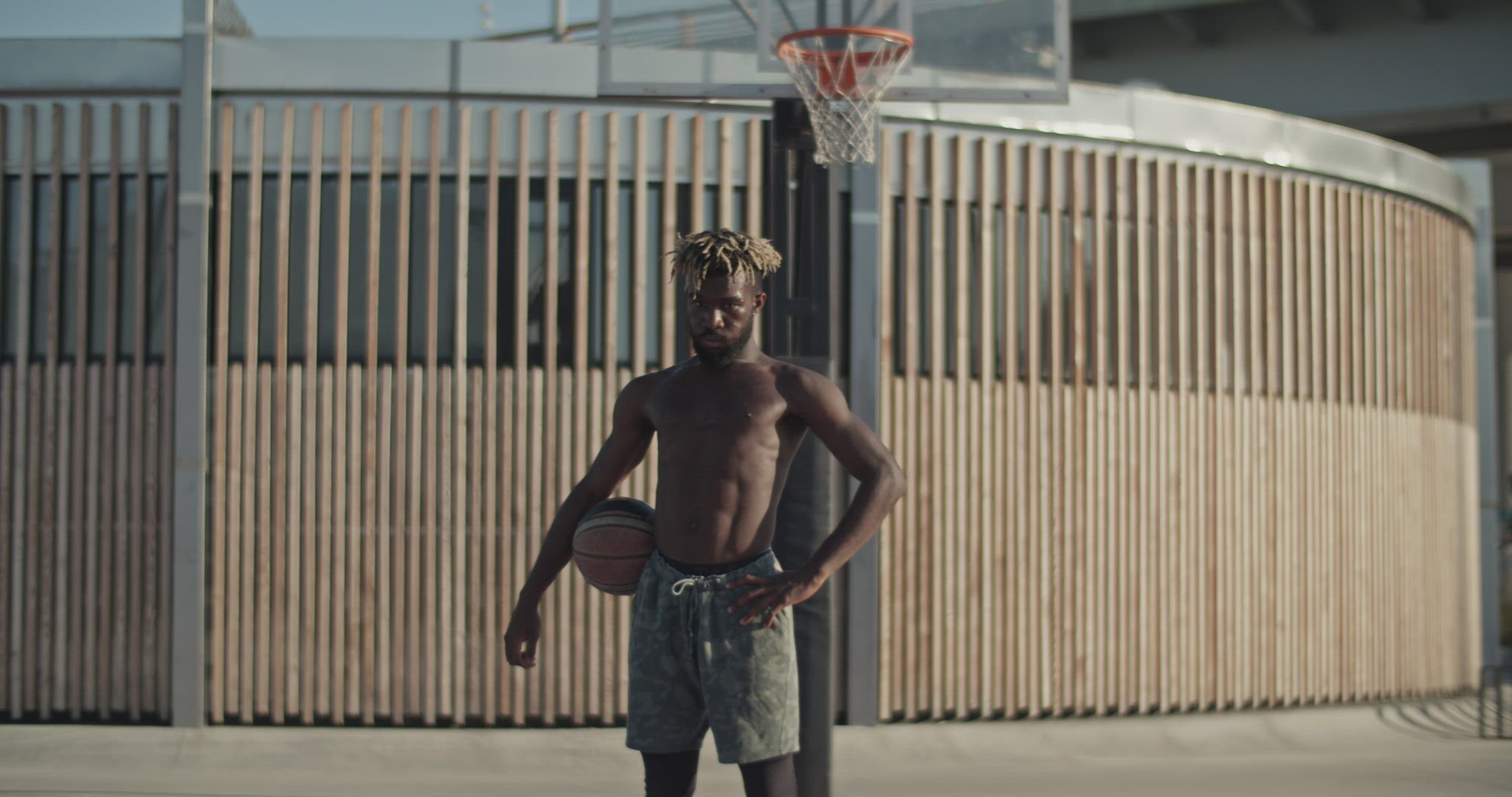 Tired black basketball player taking break